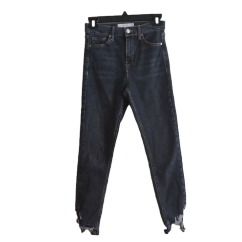 Topshop high rise super Skinny Jamie style jeans. Super distressed at hems. 26